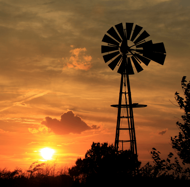A picture of windmill in the sunset